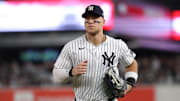 Oct 2, 2025; Bronx, New York, USA; New York Yankees outfielder Aaron Judge (99) heads for the dugout between innings during game three of the Wildcard round for the 2025 MLB playoffs against the Boston Red Sox at Yankee Stadium. Mandatory Credit: Vincent Carchietta-Imagn Images