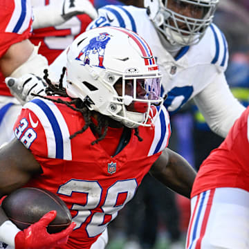 Dec 1, 2024; Foxborough, Massachusetts, USA; New England Patriots running back Rhamondre Stevenson (38) runs the ball against the Indianapolis Colts during the second half at Gillette Stadium. Mandatory Credit: Eric Canha-Imagn Images
