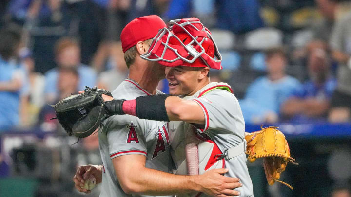 Aug 20, 2024; Kansas City, Missouri, USA; Los Angeles Angels pitcher Ben Joyce (44) celebrates with center fielder Kevin Pillar (12) after the win over the Kansas City Royals at Kauffman Stadium. Mandatory Credit: Denny Medley-USA TODAY Sports