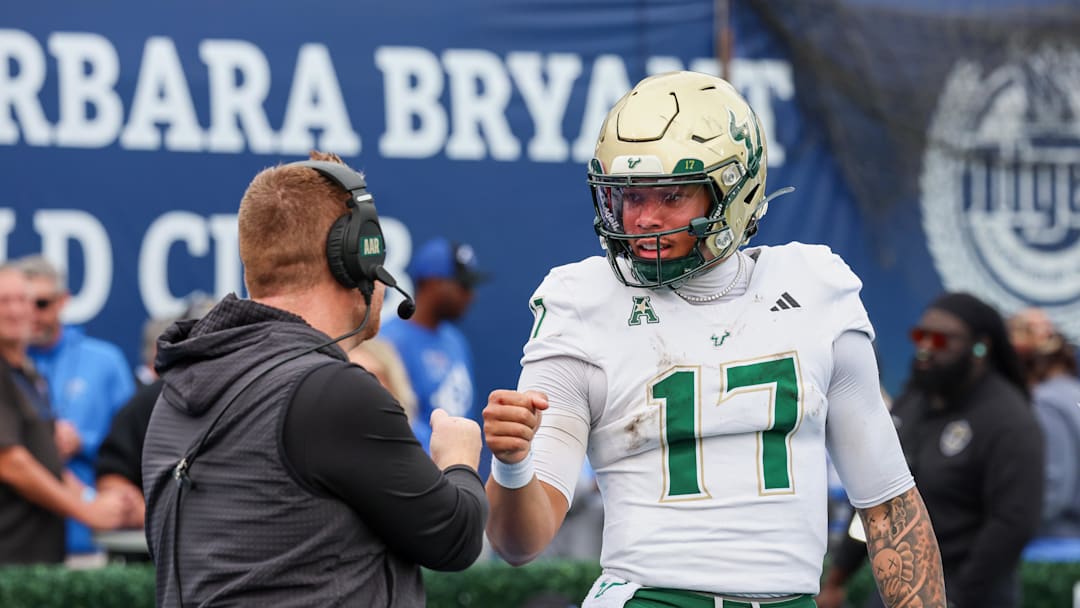 Byrum Brown and head coach Alex Golesh