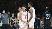Houston Cougars guard Kingston Flemings (4) celebrates with teammates after scoring during the second half against the Towson Tigers at Fertitta Center.