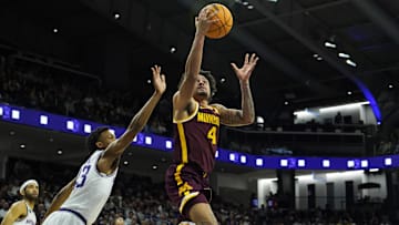 Mar 9, 2024; Evanston, Illinois, USA; Minnesota Golden Gophers guard Braeden Carrington (4) goes to the basket against Northwestern Wildcats guard Blake Smith (43) during the first half at Welsh-Ryan Arena. Mandatory Credit: David Banks-Imagn Images