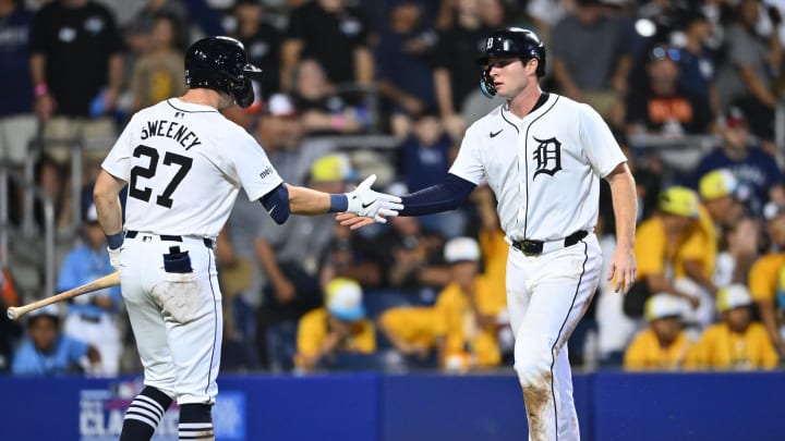 Aug 18, 2024; Williamsport, Pennsylvania, USA; Detroit Tigers infielder Colt Keith (33) reacts with infielder Trey Sweeney (27) after scoring against the New York Yankees in the ninth inning at BB&T Ballpark at Historic Bowman Field.