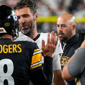 Pittsburgh Steelers quarterback Aaron Rodgers (8) and Cincinnati Bengals quarterback Joe Flacco (16) shake hands after the fourth quarter of the NFL Week 7 game between the Cincinnati Bengals and the Pittsburgh Steelers at Paycor Stadium in downtown Cincinnati on Thursday, Oct. 16, 2025. The Bengals won, 33-31.