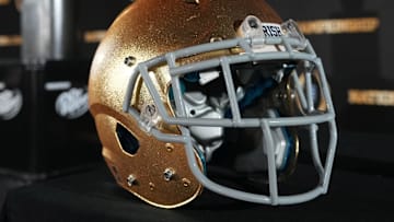 Jan 19, 2025; Atlanta, GA, USA; A Notre Dame Fighting Irish helmet and College Football Playoff National Championship trophy at press conference at The Westin Peachtree Plaza, Savannah Ballroom. Mandatory Credit: Kirby Lee-Imagn Images