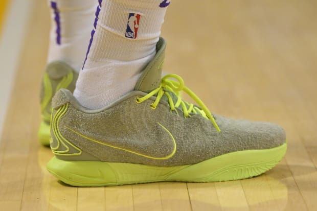 Los Angeles Lakers forward LeBron James' green Nike basketball shoes.