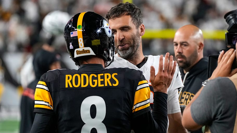 Joe Flacco and Aaron Rodgers greet each other after a game