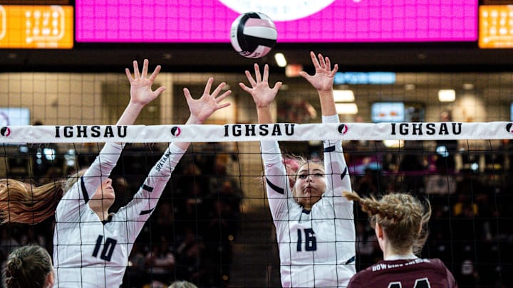 Pleasant Valley's Stella Smith (10) and Mazie Sweers (16) attempt to block a spike from Dowling Catholic's Ava Groeteke (14) during the Iowa High School State Volleyball tournament at Xtream Arena last year. The Spartans are the new No. 1 in Class 5A. Pleasant Valley's Stella Smith (10) and Mazie Sweers (16) attempt to block a spike from Dowling Catholic's Ava Groeteke (14) during the Iowa High School State Volleyball tournament at Xtream Arena last year. The Spartans are the new No. 1 in Class 5A.