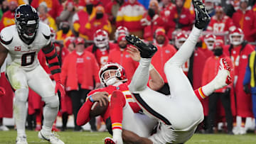 Jan 18, 2025; Kansas City, Missouri, USA; Kansas City Chiefs quarterback Patrick Mahomes (15) is sacked by the Houston Texans during the fourth quarter of a 2025 AFC divisional round game at GEHA Field at Arrowhead Stadium. Mandatory Credit: Denny Medley-Imagn Images