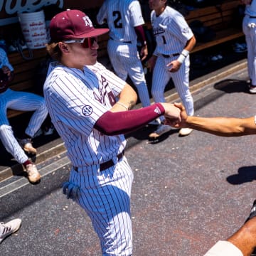 Jun 23, 2024; Omaha, NE, USA; Texas A&M Aggies catcher Hank Bard (48) and outfielder Braden Montgomery (6) before game 2 of the College Baseball World Series against the Tennessee Volunteers at Charles Schwab Field Omaha.  