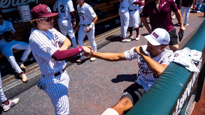 Jun 23, 2024; Omaha, NE, USA; Texas A&M Aggies catcher Hank Bard (48) and outfielder Braden Montgomery (6) before game 2 of the College Baseball World Series against the Tennessee Volunteers at Charles Schwab Field Omaha.  