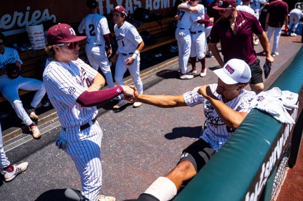 Texas A&M Aggies catcher Hank Bard and outfielder Braden Montgomery before game 2 of the College Baseball World Series.