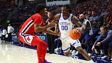 Feb 4, 2025; Oxford, Mississippi, USA; Kentucky Wildcats guard Otega Oweh (00) drives to the basket as Mississippi Rebels forward Jaemyn Brakefield (4) defends during the first half at The Sandy and John Black Pavilion at Ole Miss. Mandatory Credit: Petre Thomas-Imagn Images