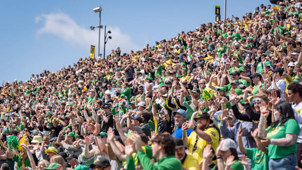Oregon fans sing and dance along to shout as the Fighting Ducks face off against Mighty Oregon in the Oregon Ducks spring gam