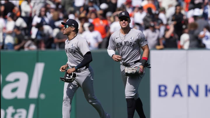 Jun 2, 2024; San Francisco, California, USA; New York Yankees right fielder Juan Soto (left) and center fielder Aaron Judge (right) jog off the field after defeating the San Francisco Giants at Oracle Park. Mandatory Credit: Darren Yamashita-USA TODAY Sports