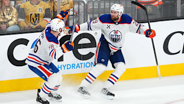 Edmonton Oilers center Leon Draisaitl (29) celebrates with defenseman Jake Walman (96) after scoring a game-winning goal against the Vegas Golden Knights