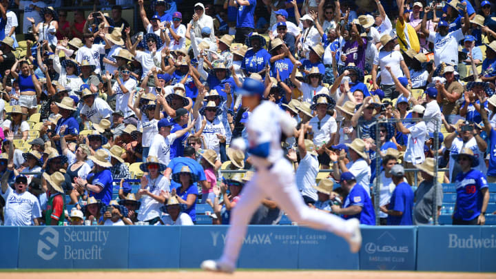 Fans cheer after Dodgers designated hitter Shohei Ohtani hits a solo home run against the Kansas City Royals at Dodger Stadium.