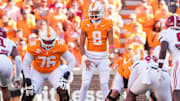 Tennessee quarterback Nico Iamaleava stands at the line of scrimmage before a play against Alabama.