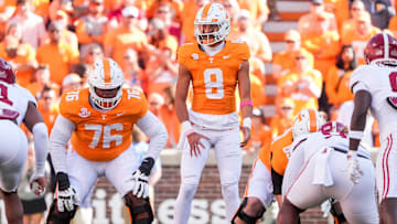 Tennessee quarterback Nico Iamaleava stands at the line of scrimmage before a play against Alabama.
