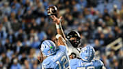 Nov 16, 2024; Chapel Hill, North Carolina, USA;  DUPLICATE***North Carolina Tar Heels defensive lineman Beau Atkinson (12)***North Carolina Tar Heels quarterback Jacolby Criswell (12) has his pass tipped in the third quarter at Kenan Memorial Stadium. Mandatory Credit: Bob Donnan-Imagn Images