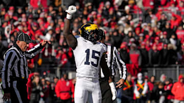 Michigan Wolverines linebacker Ernest Hausmann (15) celebrates after tackling Ohio State Buckeyes quarterback Will Howard (18) during the first half of Saturday’s NCAA Division I football game at Ohio Stadium.