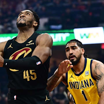May 13, 2025; Cleveland, Ohio, USA; Cleveland Cavaliers guard Donovan Mitchell (45) drives to the basket against Indiana Pacers forward Obi Toppin (1) during the first half of game five of the second round for the 2025 NBA Playoffs at Rocket Arena. Mandatory Credit: Ken Blaze-Imagn Images