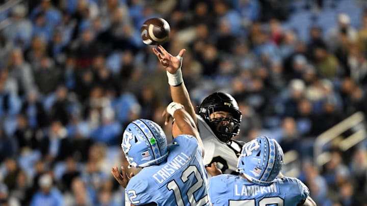 Nov 16, 2024; Chapel Hill, North Carolina, USA; DUPLICATE***North Carolina Tar Heels defensive lineman Beau Atkinson (12)***North Carolina Tar Heels quarterback Jacolby Criswell (12) has his pass tipped in the third quarter at Kenan Memorial Stadium. Mandatory Credit: Bob Donnan-Imagn Images Nov 16, 2024; Chapel Hill, North Carolina, USA; DUPLICATE***North Carolina Tar Heels defensive lineman Beau Atkinson (12)***North Carolina Tar Heels quarterback Jacolby Criswell (12) has his pass tipped in the third quarter at Kenan Memorial Stadium. Mandatory Credit: Bob Donnan-Imagn Images