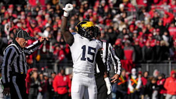 Michigan Wolverines linebacker Ernest Hausmann (15) celebrates after tackling Ohio State Buckeyes quarterback Will Howard (18) during the first half of Saturday’s NCAA Division I football game at Ohio Stadium.