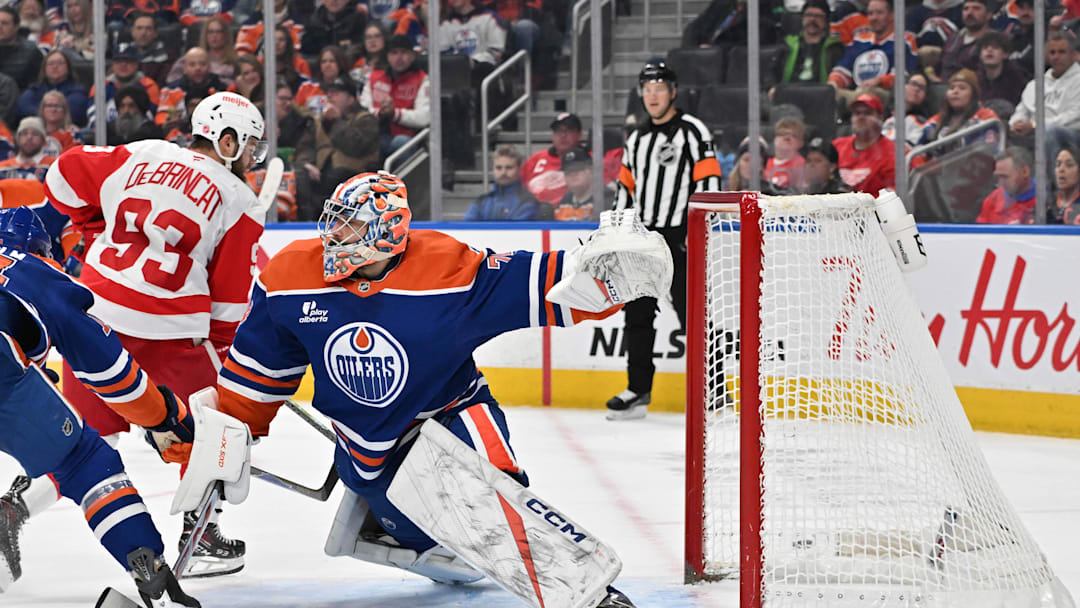 Dec 11, 2025; Edmonton, Alberta, CAN; Edmonton Oilers goalie Stuart Skinner (74) and Detroit Red Wings right winger Alex DeBrincat (93) are seen out on the ice during the second period at Rogers Place. Mandatory Credit: Walter Tychnowicz-Imagn Images