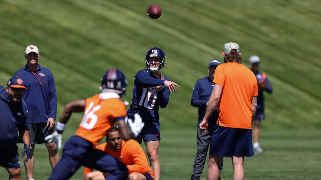 May 23, 2024; Englewood, CO, USA; Denver Broncos quarterback Bo Nix (10) passes to wide receiver Troy Franklin (16) during organized team activities at Centura Health Training Center. Mandatory Credit: Isaiah J. Downing-USA TODAY Sports