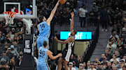Nov 18, 2025; San Antonio, Texas, USA;  Memphis Grizzlies center Zach Edey (14) blocks a shot by San Antonio Spurs forward Harrison Barnes (40) in the second half at Frost Bank Center. Mandatory Credit: Daniel Dunn-Imagn Images