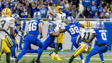 Dec 5, 2024; Detroit, Michigan, USA; Green Bay Packers quarterback Jordan Love (10) is pressured by Detroit Lions linebacker Ezekiel Turner (47) and defensive end Za'Darius Smith (99) during the first half at Ford Field. Mandatory Credit: David Reginek-Imagn Images