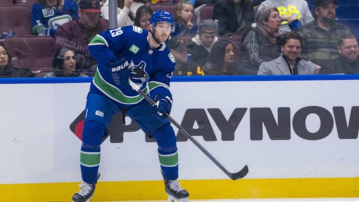 Feb 2, 2025; Vancouver, British Columbia, CAN; Vancouver Canucks defenseman Marcus Pettersson (29) passes the puck during the third period against the Detroit Red Wings at Rogers Arena. Mandatory Credit: Bob Frid-Imagn Images