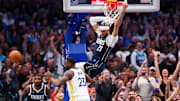 Apr 5, 2024; Dallas, Texas, USA;  Dallas Mavericks center Daniel Gafford (21) dunks past Golden