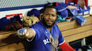 May 7, 2025; Anaheim, California, USA;  Toronto Blue Jays first baseman Vladimir Guerrero Jr. (27) reacts in the dugout after scoring a run during the sixth inning against the Los Angeles Angels at Angel Stadium. 