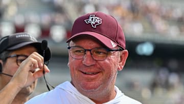 Oct 5, 2024; College Station, Texas, USA; Texas A&M Aggies head coach Mike Elko gets ready for a pre-game interview with the SEC Nation prior to the game against the Missouri Tigers at Kyle Field. Mandatory Credit: Maria Lysaker-Imagn Images. 