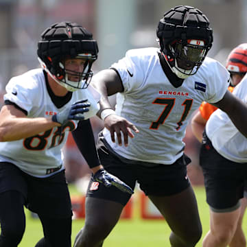 Jul 26, 2024; Cincinnati, OH, USA; Cincinnati Bengals offensive tackle Amarius Mims (71) run blocks during training camp practice at Kettering Health Practice Fields. Mandatory Credit: Kareem Elgazzar-Imagn Images