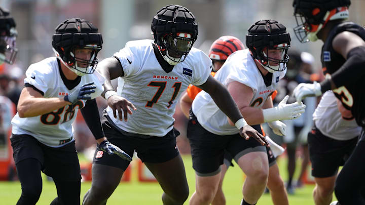 Jul 26, 2024; Cincinnati, OH, USA; Cincinnati Bengals offensive tackle Amarius Mims (71) run blocks during training camp practice at Kettering Health Practice Fields. Mandatory Credit: Kareem Elgazzar-Imagn Images