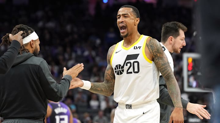 Dec 8, 2024; Sacramento, California, USA; Utah Jazz forward John Collins (20) slaps hands with guard Patty Mills (left) during the third quarter against the Sacramento Kings at Golden 1 Center. Mandatory Credit: Darren Yamashita-Imagn Images