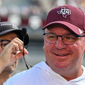 Oct 5, 2024; College Station, Texas, USA; Texas A&M Aggies head coach Mike Elko gets ready for a pre-game interview with the SEC Nation prior to the game against the Missouri Tigers at Kyle Field. Mandatory Credit: Maria Lysaker-Imagn Images. 