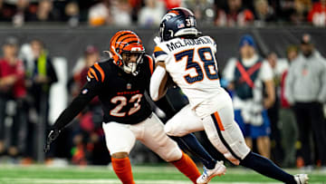 Cincinnati Bengals safety Geno Stone (22) tackles Denver Broncos running back Jaleel McLaughlin (38) in the third quarter of the NFL game at Paycor Stadium in Cincinnati on Saturday, Dec. 28, 2024.