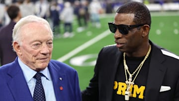 Nov 30, 2023; Arlington, Texas, USA; Colorado Buffaloes head coach Deion Sanders (right) talks with Dallas Cowboys owner Jerry Jones before the game against the Seattle Seahawks at AT&T Stadium. Mandatory Credit: Tim Heitman-Imagn Images