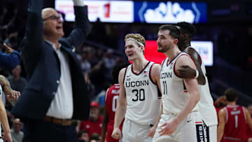 Nov 6, 2024; Storrs, Connecticut, USA; Connecticut Huskies forward Liam McNeeley (30), forward Alex Karaban (11) and Connecticut Huskies head coach Dan Hurley react after a play against the Sacred Heart Pioneers in the second half at Harry A. Gampel Pavilion. Mandatory Credit: David Butler II-Imagn Images