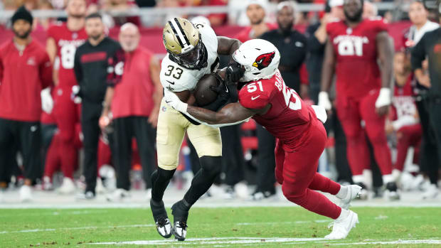 New Orleans Saints running back Jordan Mims (33) runs against Arizona Cardinals linebacker Krys Barnes (51)