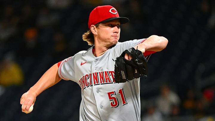 Cincinnati Reds starting pitcher Brady Singer (51) delivers a pitch
