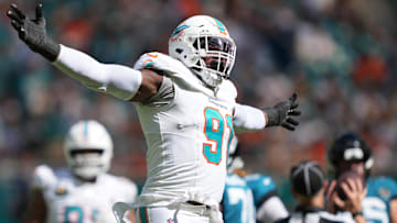 Sep 8, 2024; Miami Gardens, Florida, USA;  Miami Dolphins defensive tackle Da'Shawn Hand (91) celebrates a sack of Jacksonville Jaguars quarterback Trevor Lawrence (16) during the fourth quarter at Hard Rock Stadium. Mandatory Credit: Jim Rassol-Imagn Images