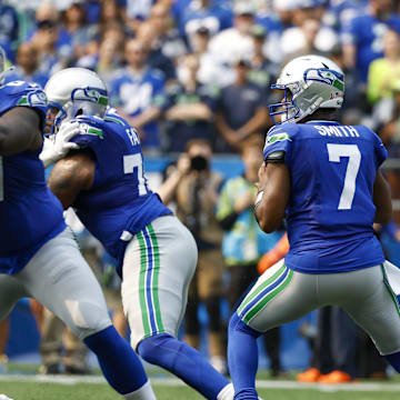 Sep 8, 2024; Seattle, Washington, USA; Seattle Seahawks quarterback Geno Smith (7) looks to pass against the Denver Broncos during the first quarter at Lumen Field. Mandatory Credit: Joe Nicholson-Imagn Images