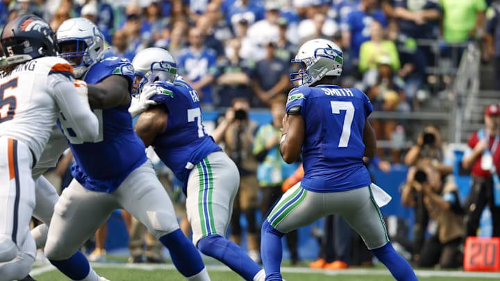 Sep 8, 2024; Seattle, Washington, USA; Seattle Seahawks quarterback Geno Smith (7) looks to pass against the Denver Broncos during the first quarter at Lumen Field. Mandatory Credit: Joe Nicholson-Imagn Images