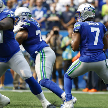 Sep 8, 2024; Seattle, Washington, USA; Seattle Seahawks quarterback Geno Smith (7) looks to pass against the Denver Broncos during the first quarter at Lumen Field.