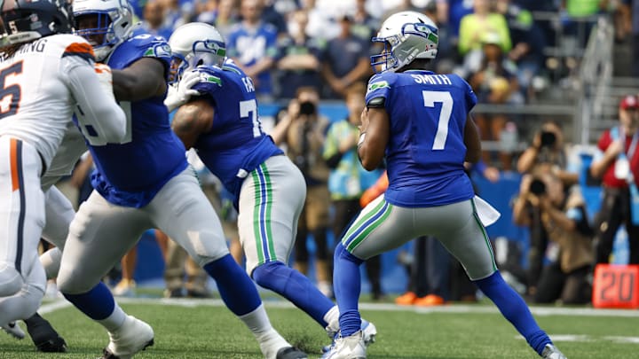 Sep 8, 2024; Seattle, Washington, USA; Seattle Seahawks quarterback Geno Smith (7) looks to pass against the Denver Broncos during the first quarter at Lumen Field.